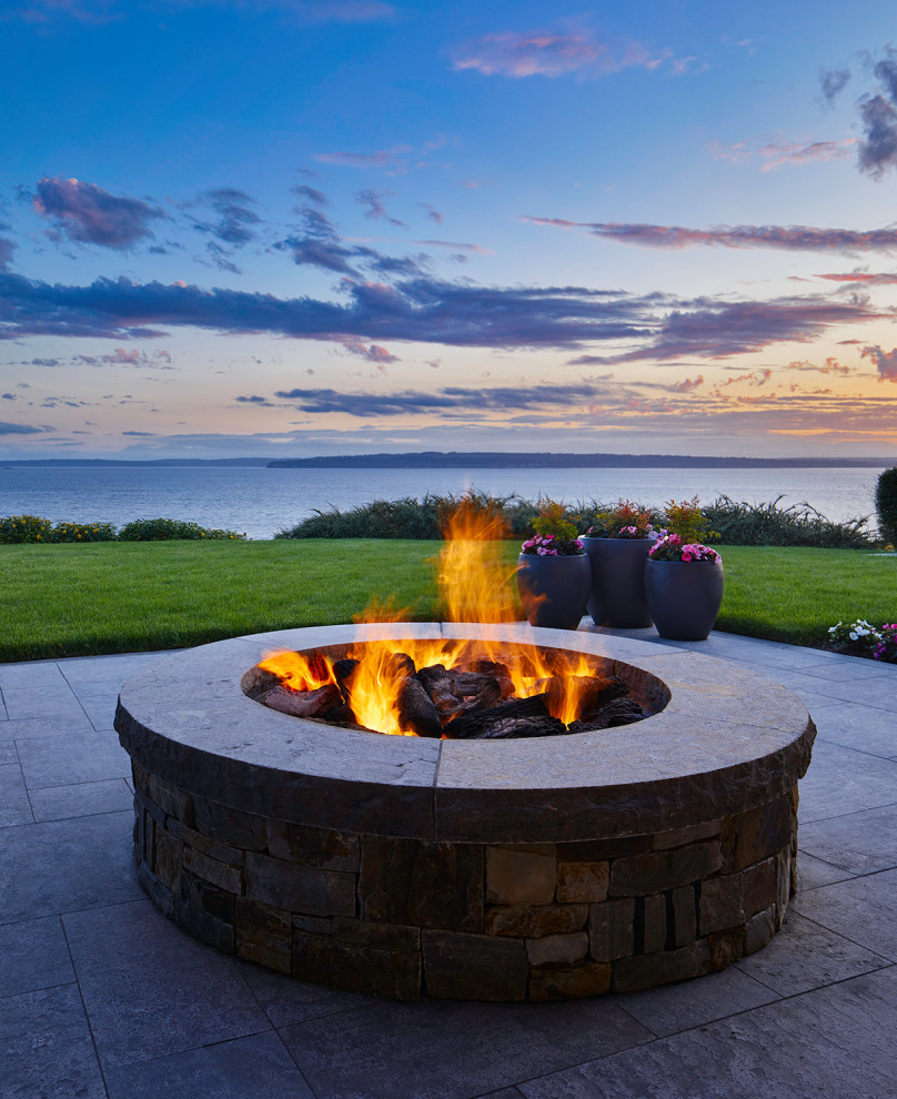 Traditional back patio in Seattle with a fire feature.
