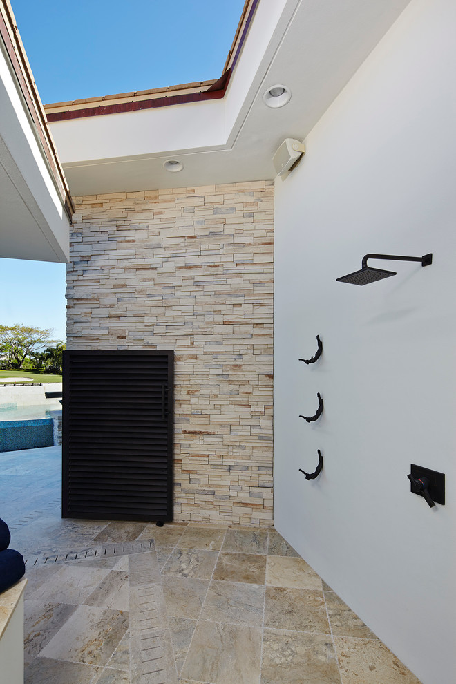 Patio fountain - contemporary stone patio fountain idea in Miami
