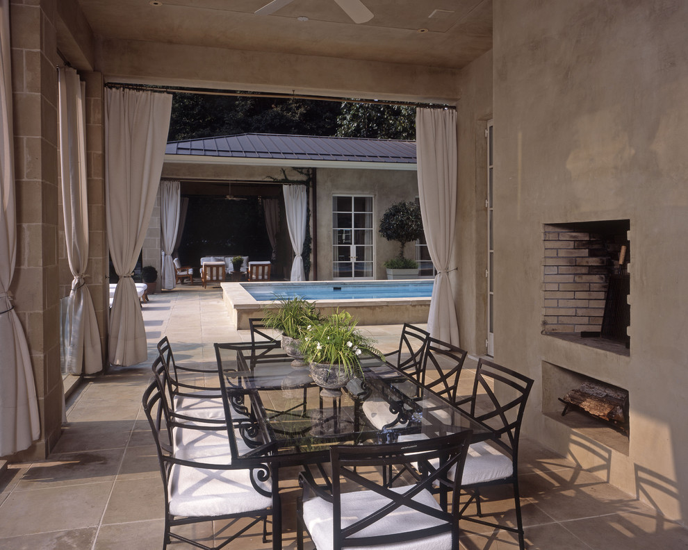 This is an example of a mediterranean patio in Atlanta with a fire feature.