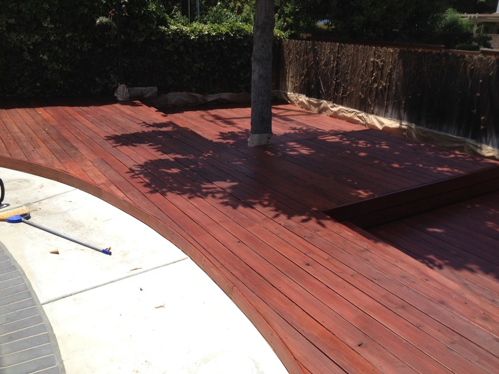 Design ideas for a large world-inspired back patio in Orange County with a water feature, decking and no cover.