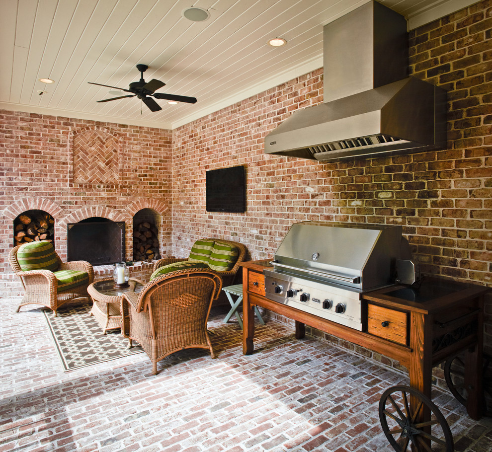 Traditional patio in Houston with brick paving and a bbq area.