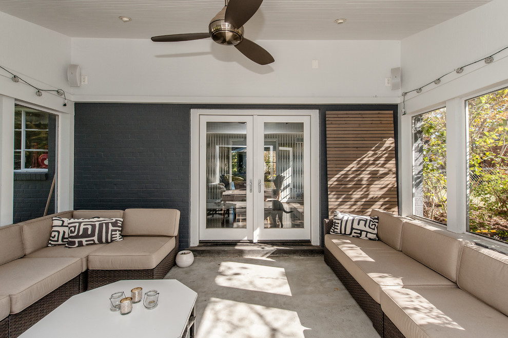 Photo of a contemporary back patio in DC Metro with a fire feature and decking.