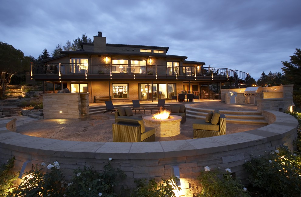 Example of a trendy patio design in Denver with a fire pit