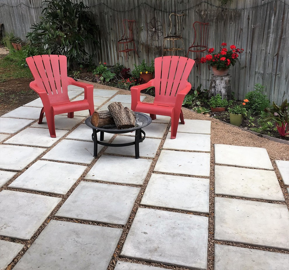 Inspiration for a medium sized classic back patio in Austin with a fire feature, concrete paving and no cover.