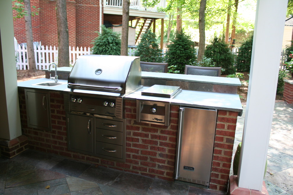 Buckhead Outdoor Brick Kitchen with Raise Bar Traditional Patio
