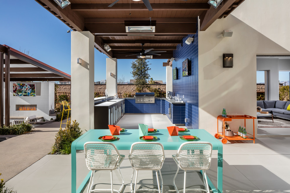 Photo of a contemporary patio in Los Angeles with a roof extension.
