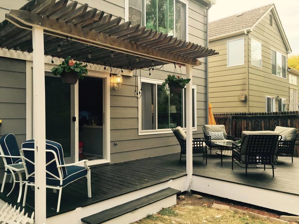 Patio - small country backyard patio idea in Denver with decking and a roof extension