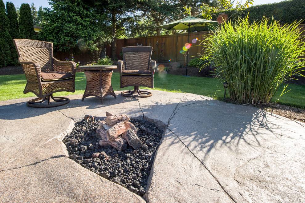 Patio - mid-sized craftsman backyard concrete patio idea in Vancouver with a fire pit