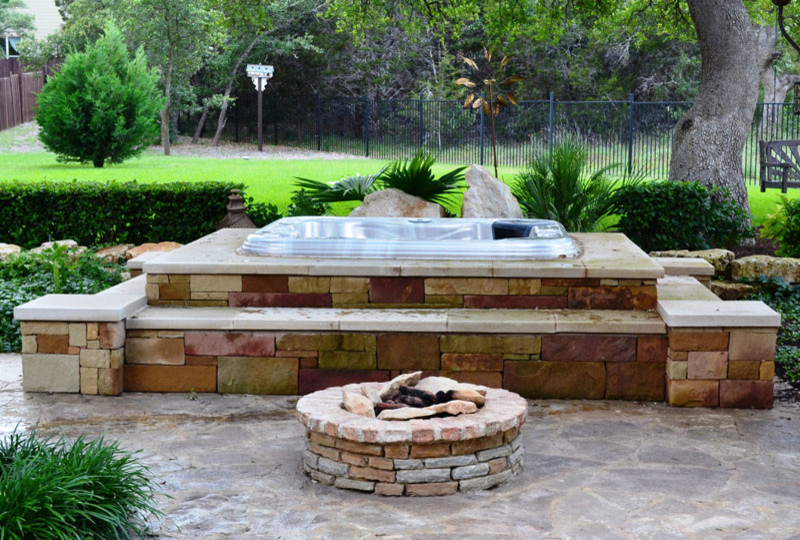 Inspiration for a large craftsman backyard patio fountain remodel in Austin with no cover