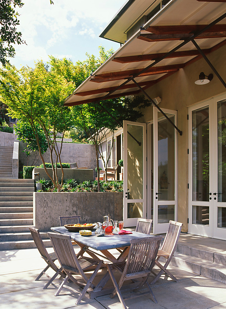 This is an example of a contemporary patio in San Francisco with an awning.