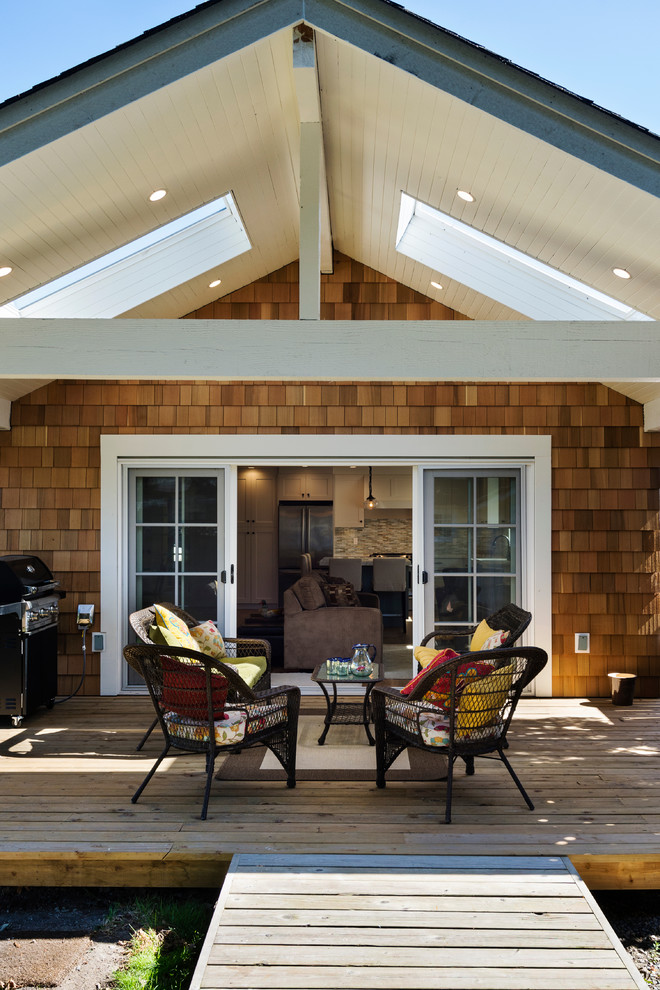 Design ideas for a medium sized nautical back patio in Vancouver with a roof extension.
