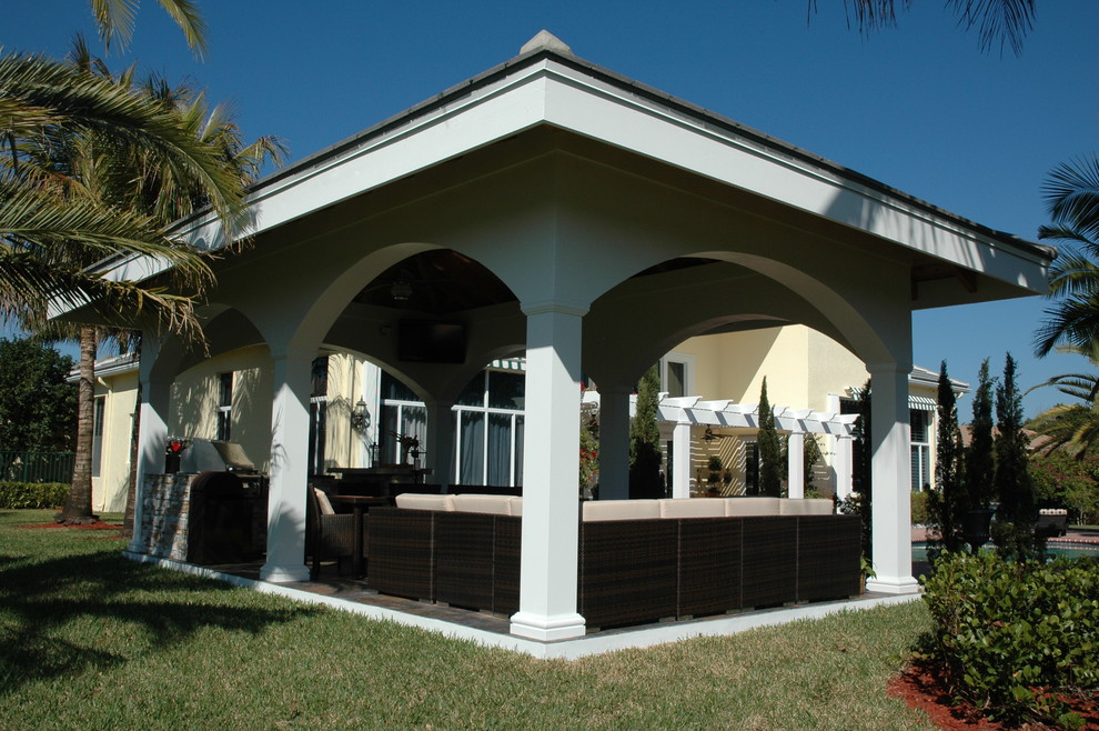 Medium sized world-inspired back patio in Miami with an outdoor kitchen and a gazebo.