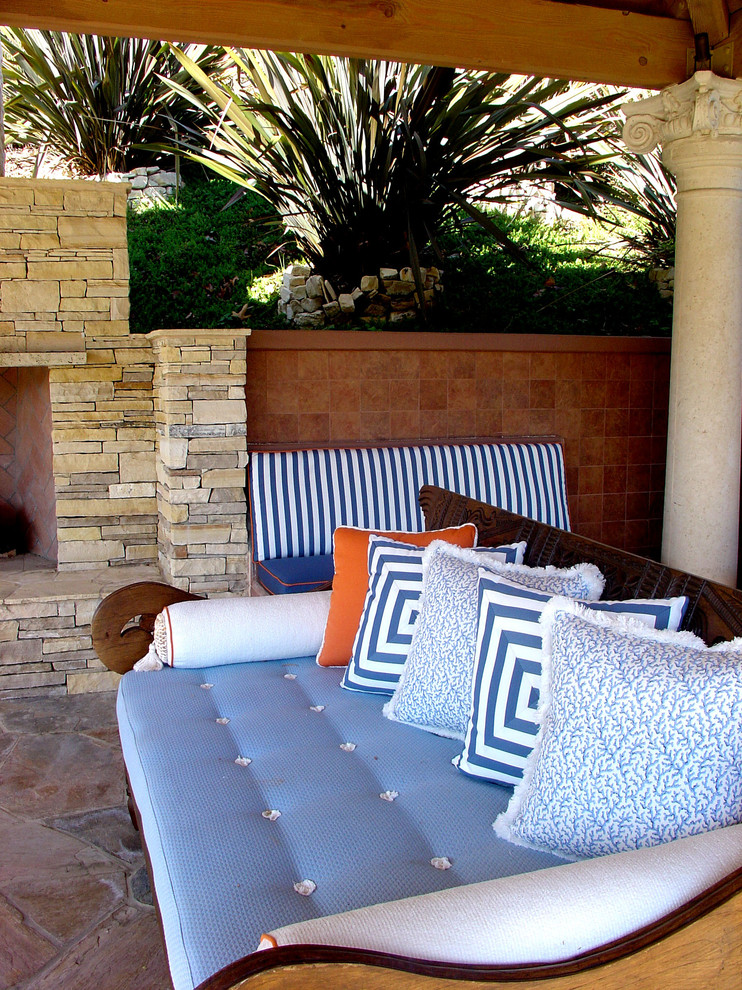 Inspiration for a large transitional backyard tile patio remodel in Los Angeles with a gazebo
