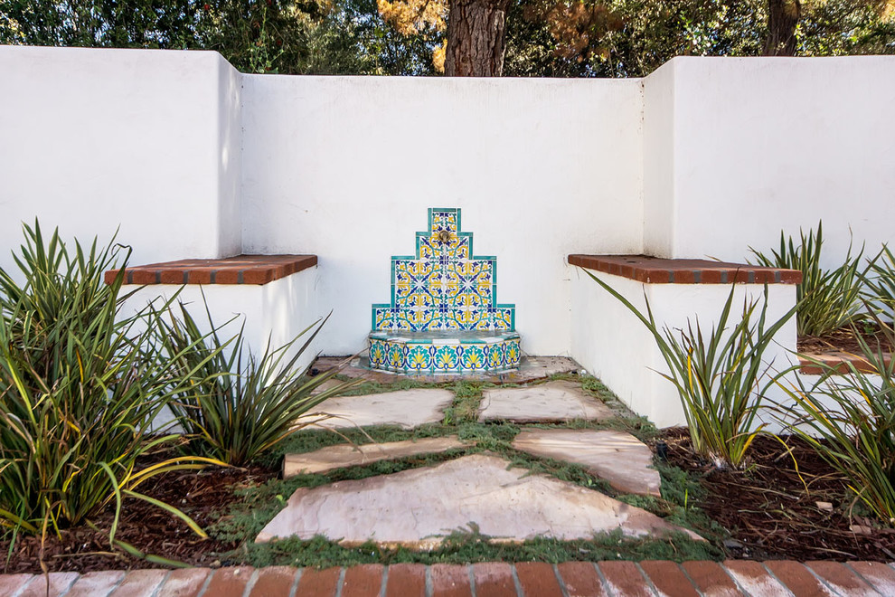Inspiration for a mediterranean patio in San Francisco with a water feature.