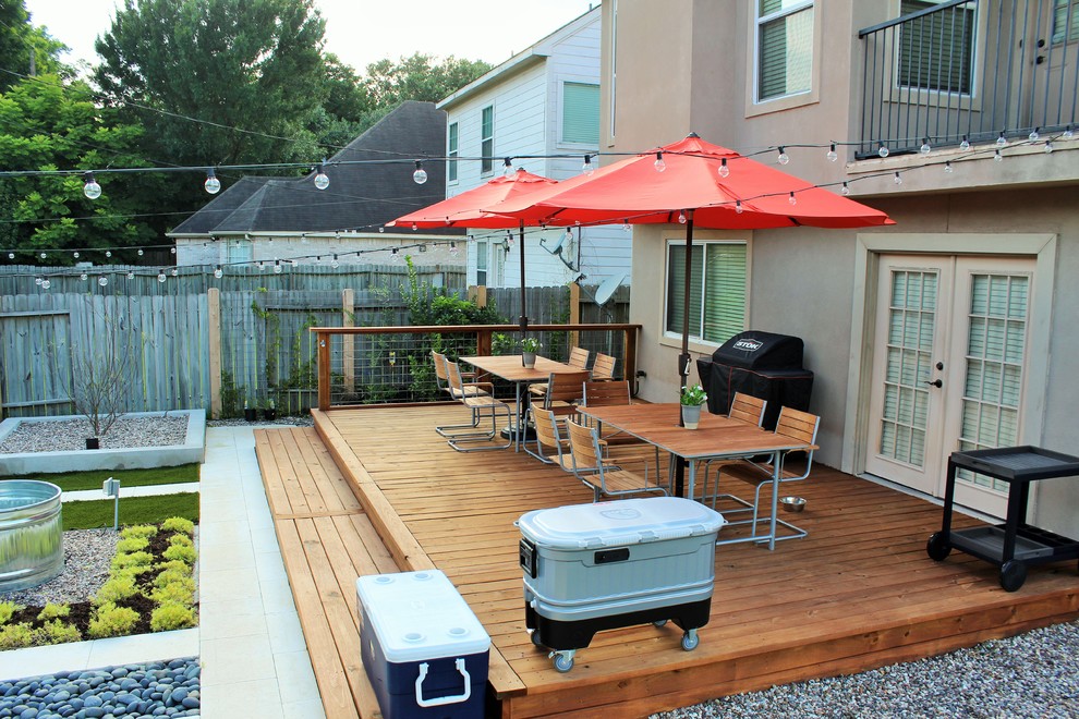 Design ideas for a medium sized modern back terrace in Houston with a fire feature.