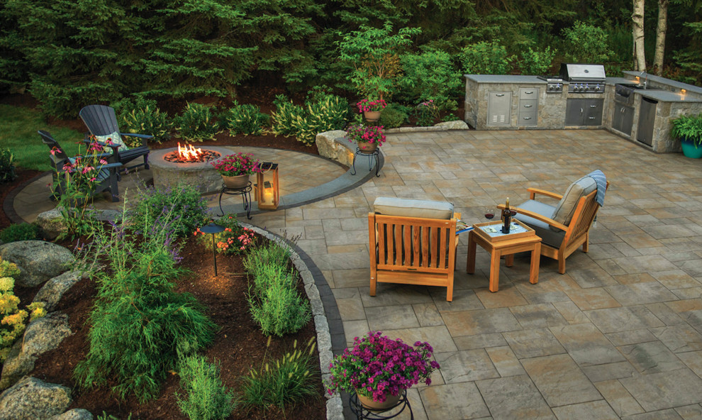 Inspiration for a large transitional backyard stamped concrete patio kitchen remodel in Philadelphia with no cover