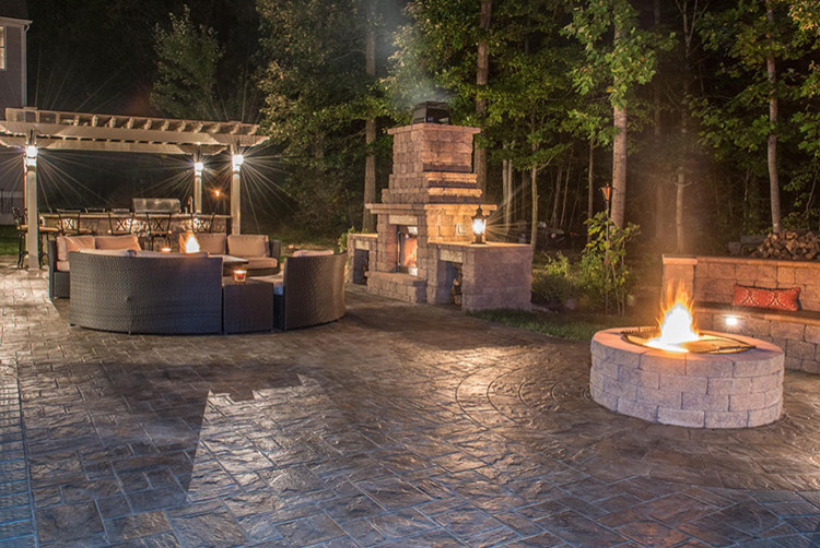 Patio - large traditional backyard concrete paver patio idea in Other with a fire pit and a pergola