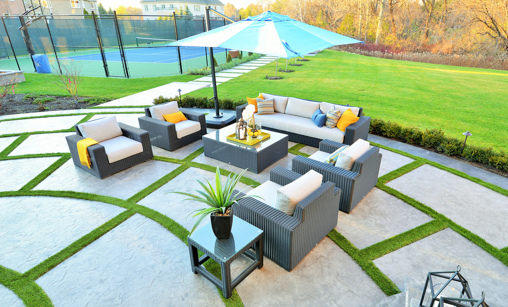 Design ideas for a large contemporary back patio in Toronto with an outdoor kitchen, concrete slabs and a gazebo.