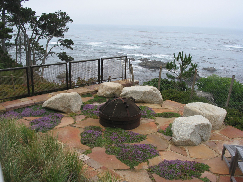 Example of a trendy patio design in San Francisco with a fire pit