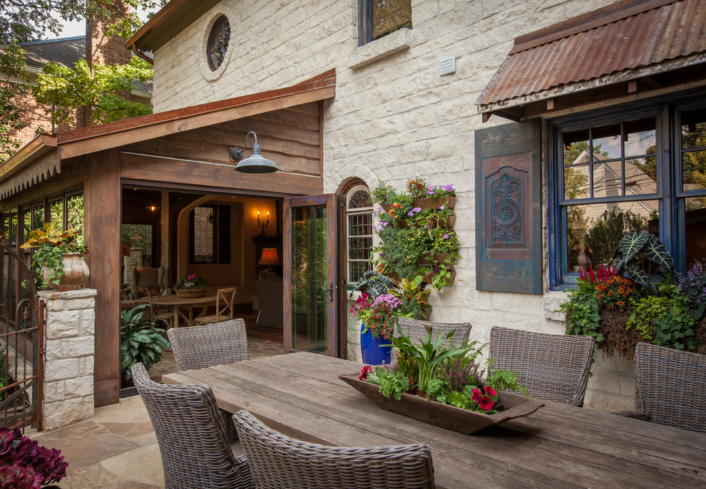 Inspiration for a rustic patio remodel in Dallas with no cover