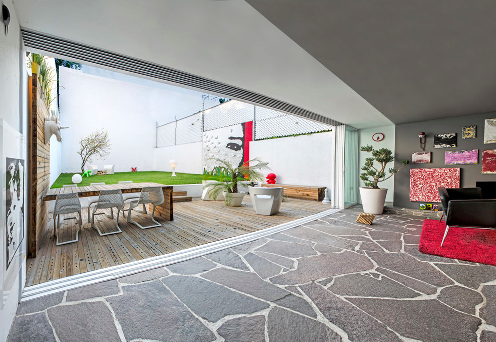 Inspiration for a contemporary patio in Mexico City with decking and no cover.