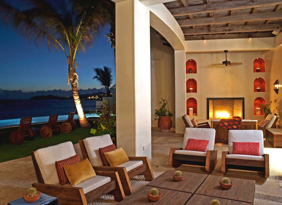This is an example of an eclectic patio in Other with a fire feature.