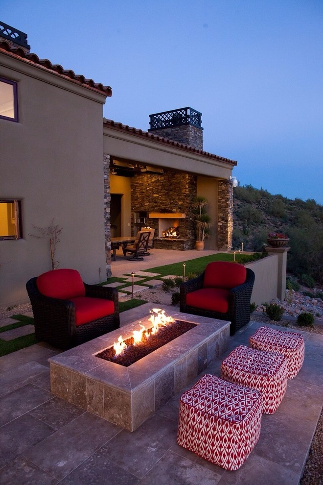 Large trendy backyard stone patio photo in Phoenix with a fire pit and no cover