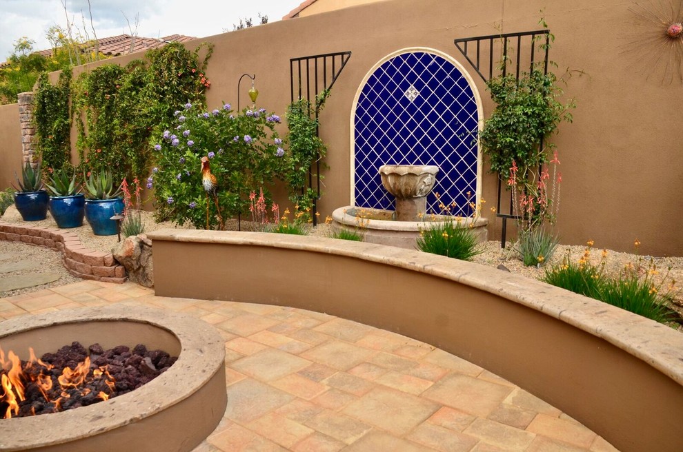 Inspiration for a medium sized back patio in Phoenix with a fire feature, tiled flooring and no cover.