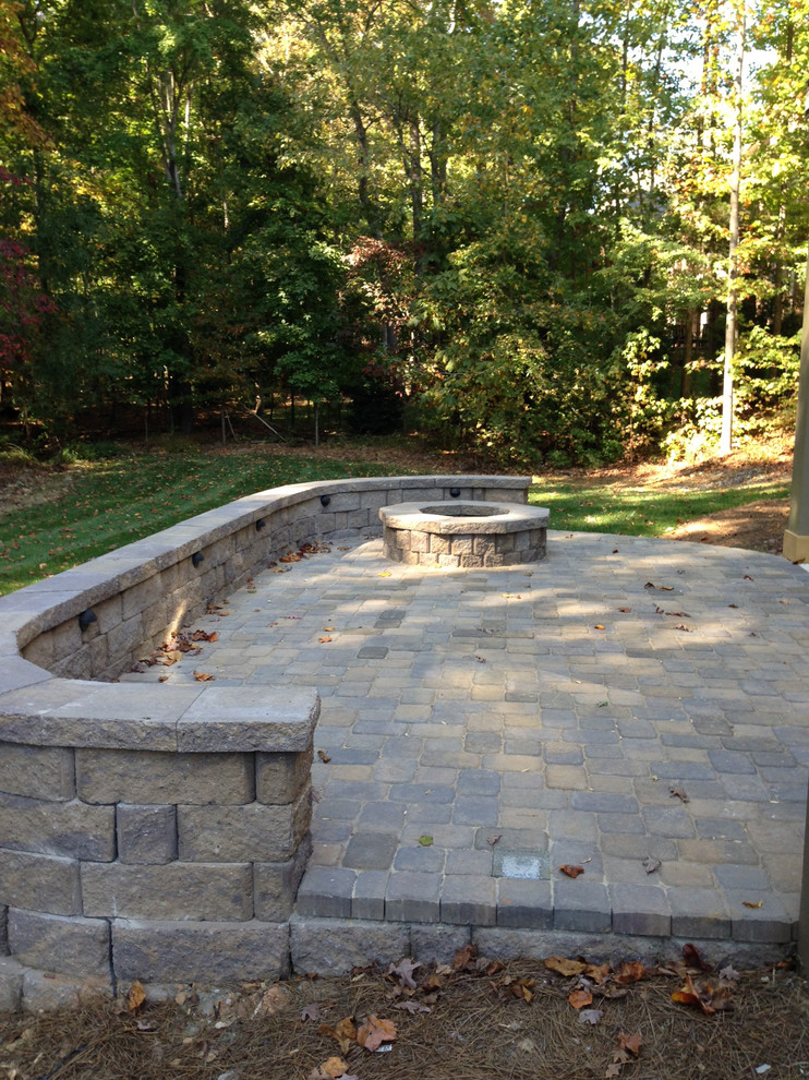 Charlotte paver patio with retaining wall and fire pit Traditional