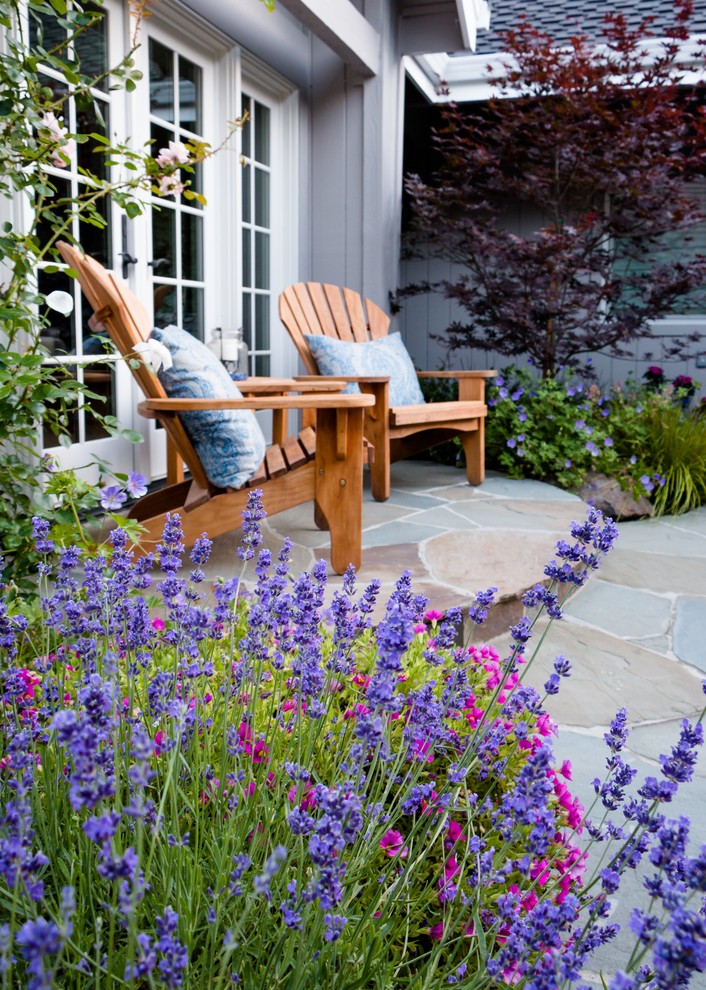 Mid-sized elegant backyard stone patio photo in San Francisco with no cover