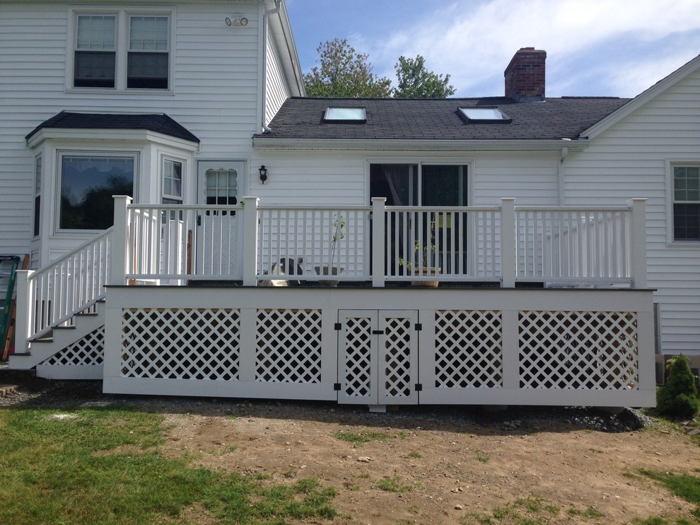 Medium sized traditional back patio in Boston with decking and no cover.