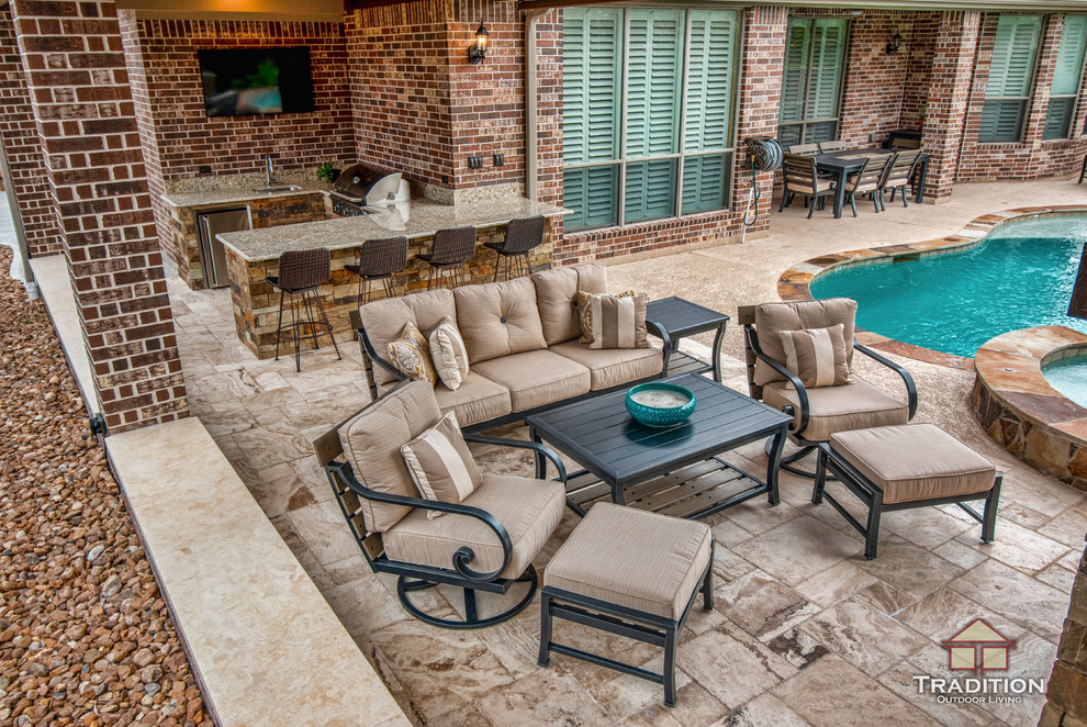 Design ideas for a medium sized rustic back patio in Houston with a fireplace, stamped concrete and a roof extension.