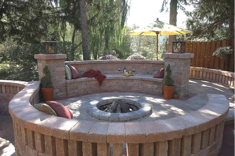 Photo of a mediterranean back patio in Detroit with brick paving.