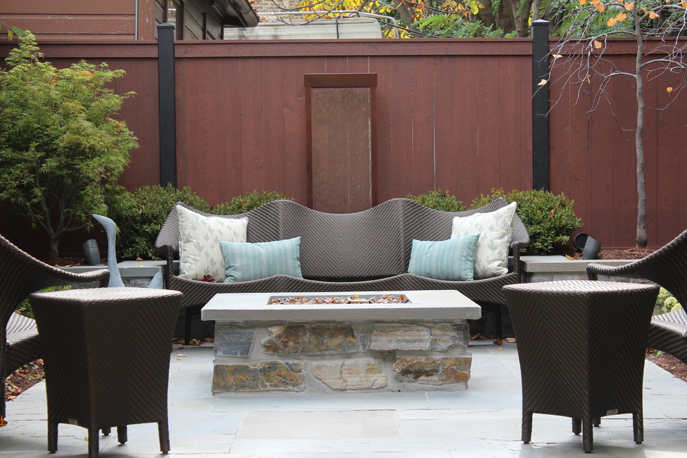 Contemporary patio in Chicago with a fire feature and no cover.