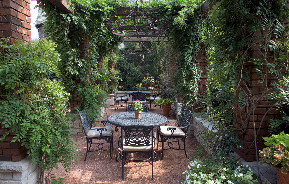 Design ideas for a large classic patio in Chicago with gravel and a pergola.