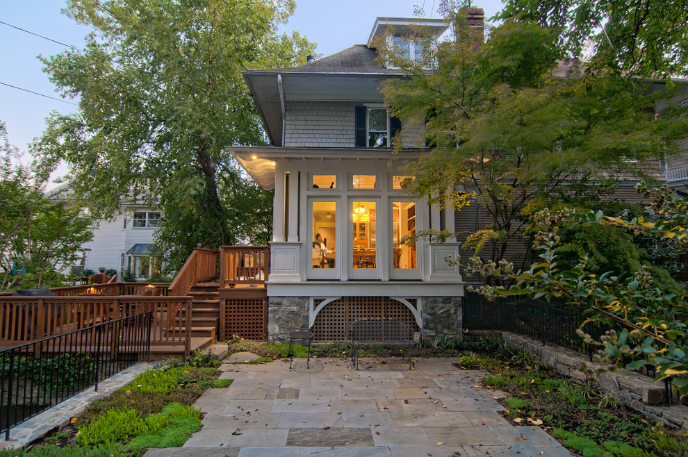 Inspiration for a large craftsman backyard stone patio remodel in DC Metro with no cover