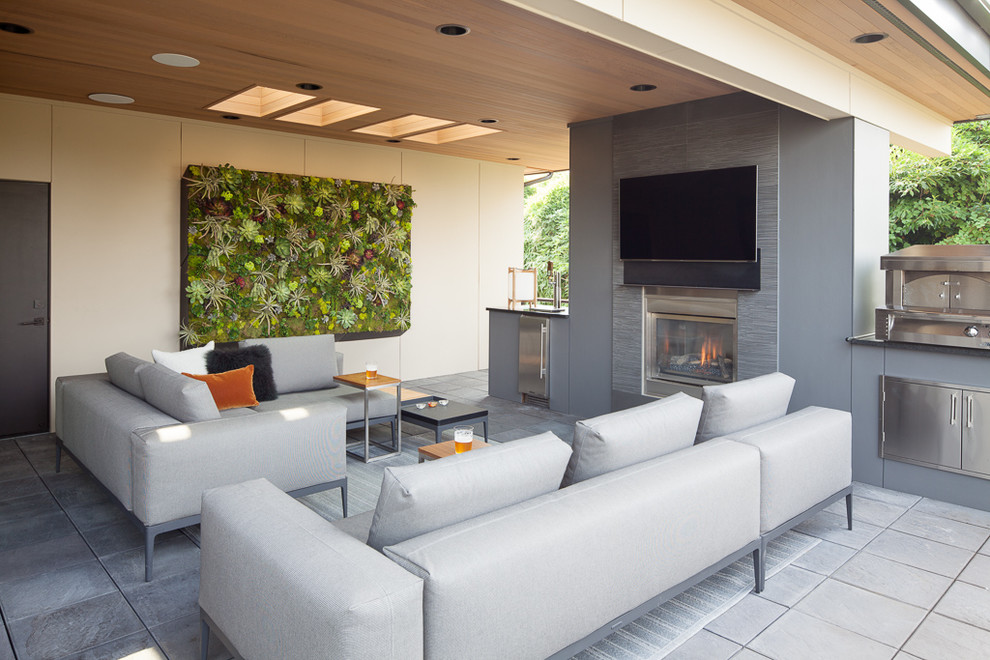 Design ideas for a contemporary patio in Seattle with a roof extension and a bar area.