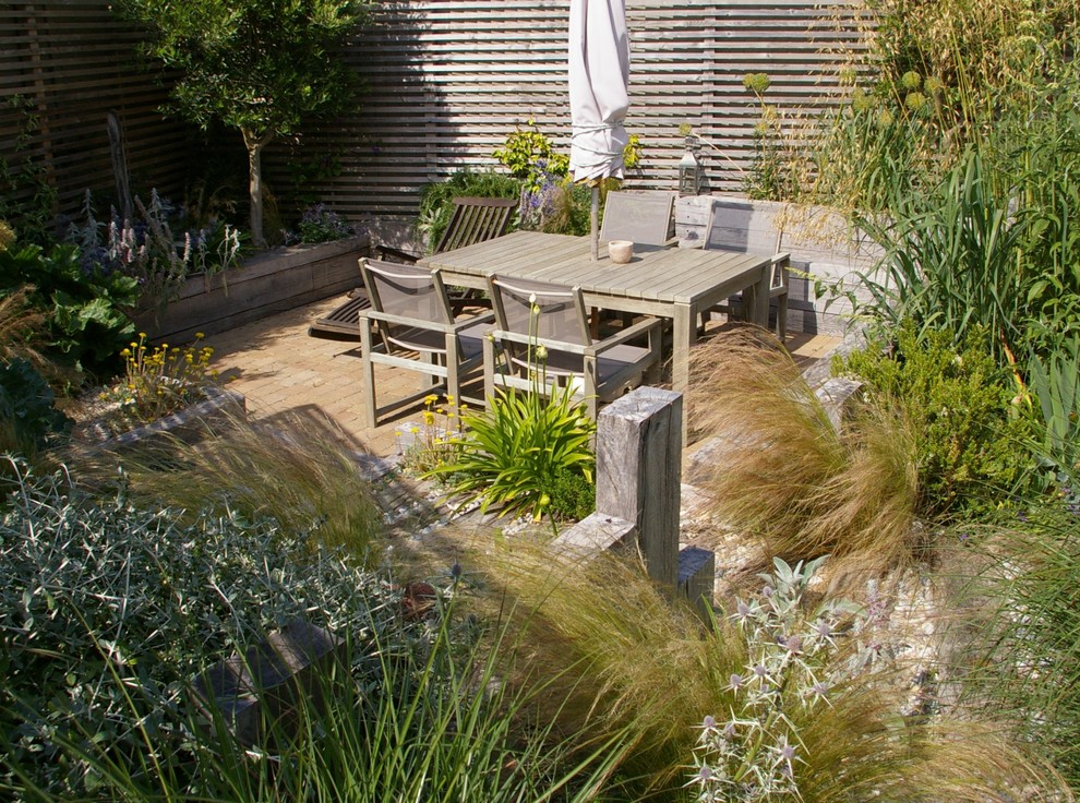 Design ideas for a beach style patio in Sussex.