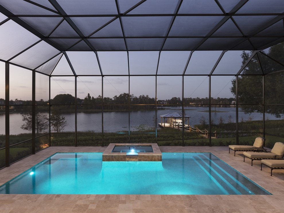 Pool - large coastal backyard brick pool idea in Orlando