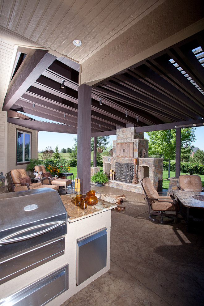 Design ideas for a classic patio in Denver with a fire feature and a pergola.