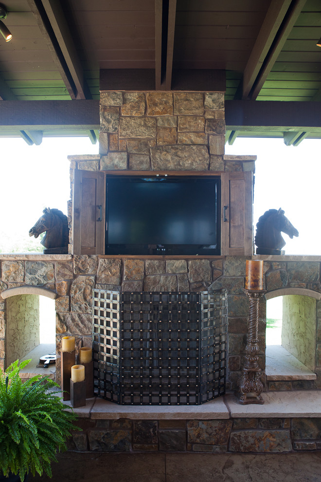 Photo of a traditional patio in Denver with a fire feature and a pergola.