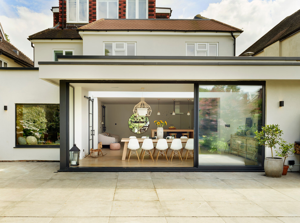 This is an example of a large contemporary back patio in Other.