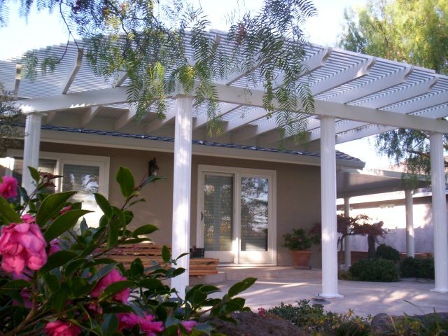 Inspiration for a medium sized back patio in Sacramento with concrete slabs and a pergola.