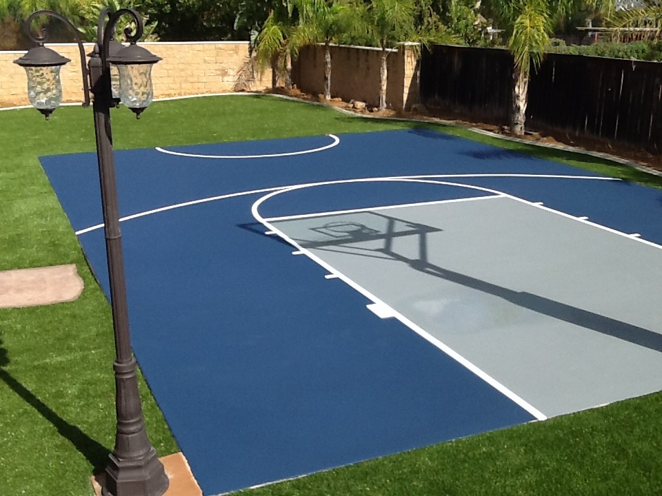 Example of a large classic backyard stamped concrete patio design in Los Angeles with no cover