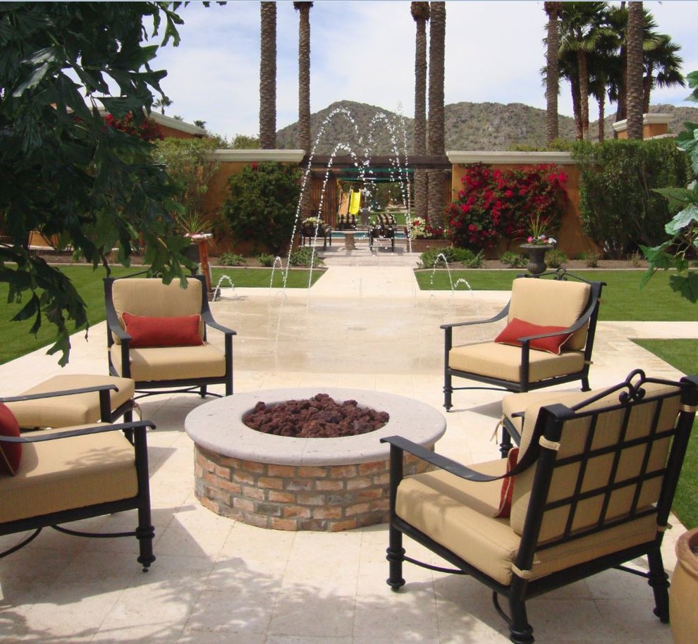 Medium sized classic back patio in Phoenix with a fire feature, tiled flooring and a pergola.