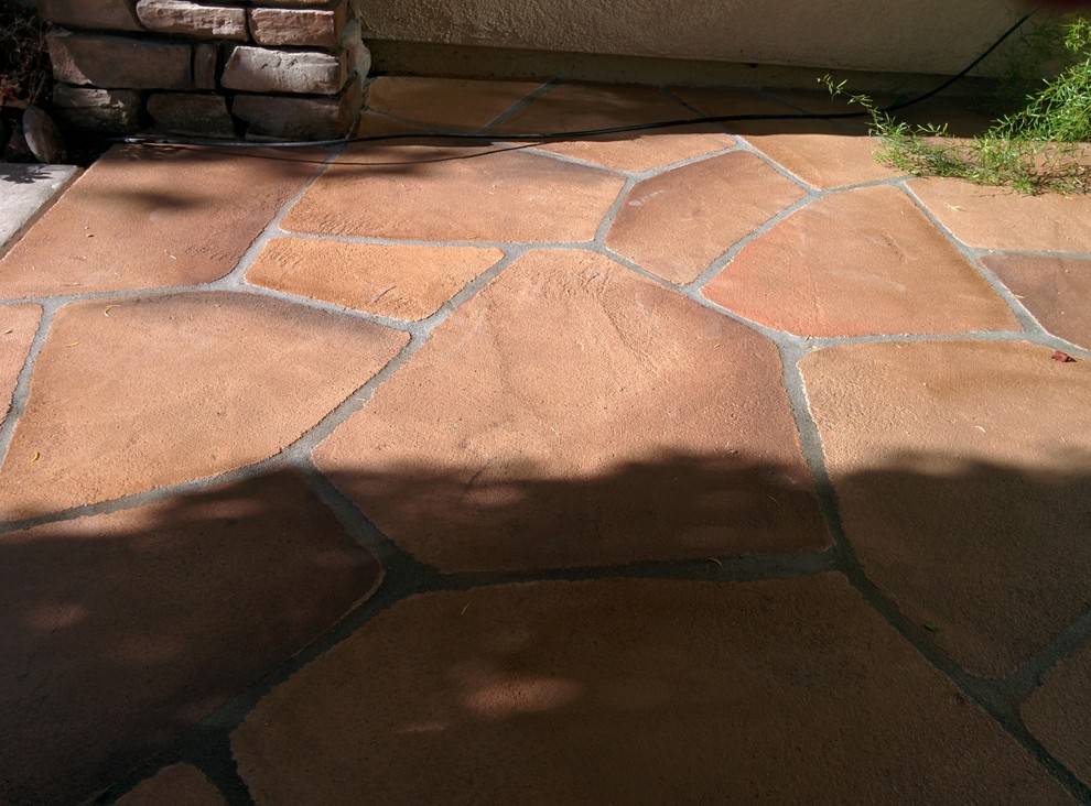 Photo of a medium sized classic back patio in San Francisco with concrete paving and a roof extension.