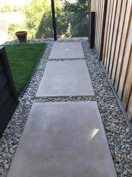 Design ideas for a large contemporary back patio in San Francisco with a fire feature, concrete slabs and no cover.