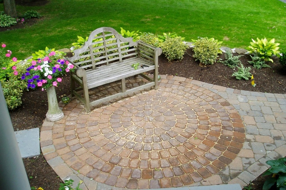 Mid-sized transitional backyard brick patio photo in New York with no cover