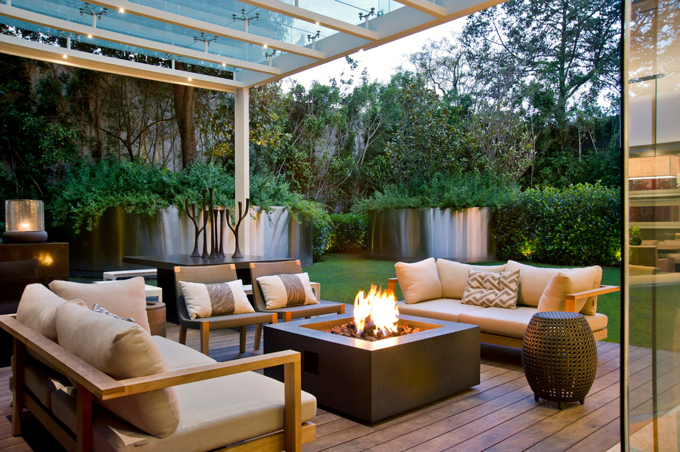 Example of a trendy patio design in Other with decking and a pergola