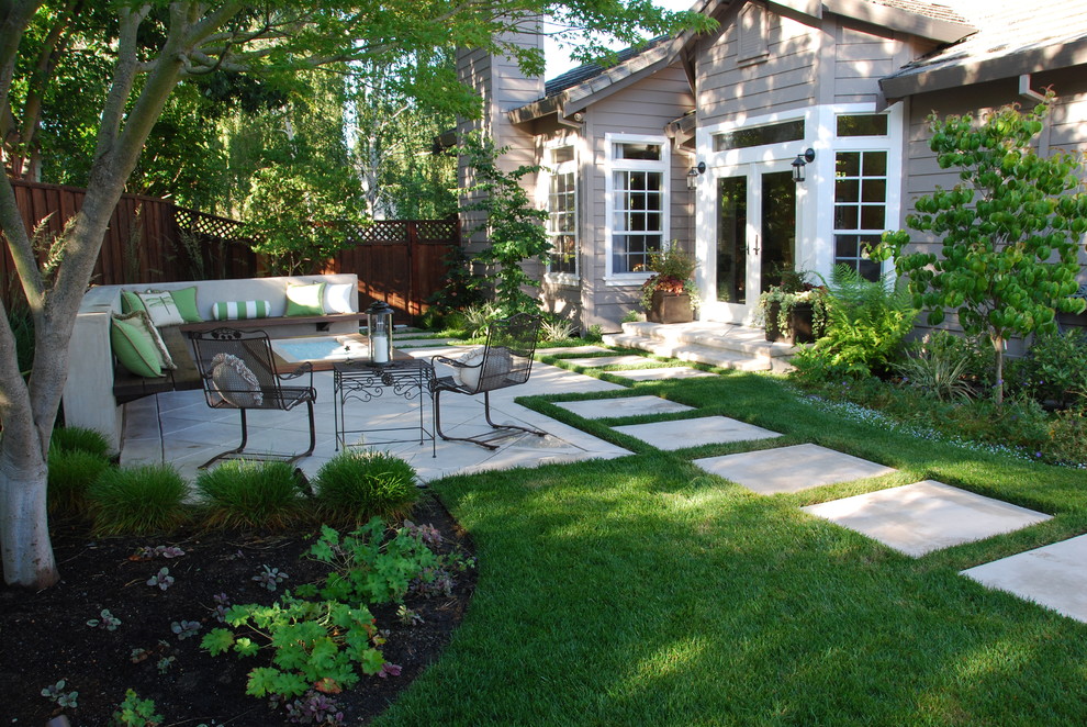 Inspiration for a mid-sized timeless backyard concrete paver patio remodel in San Francisco with a fire pit